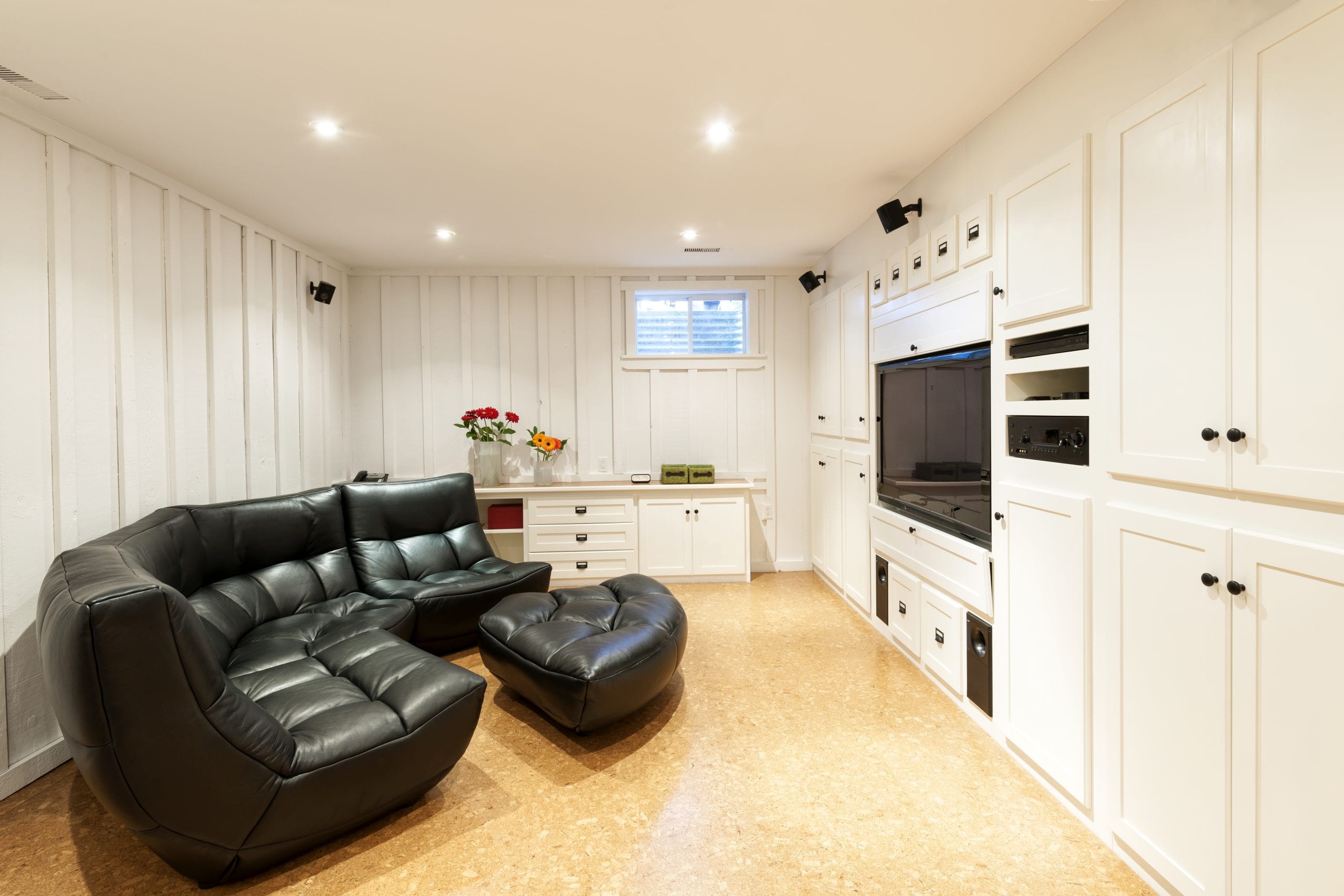An innovative garage conversion by Praiano Home Improvement, showing a garage transformed into a vibrant living space