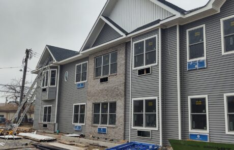 praiano-home-improvements-new-construction-bayshore-village-11 two-story building envelope with windows installed