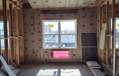 praiano-home-improvements-new-construction-bayshore-village-12 interior view showing batt insulation around window opening
